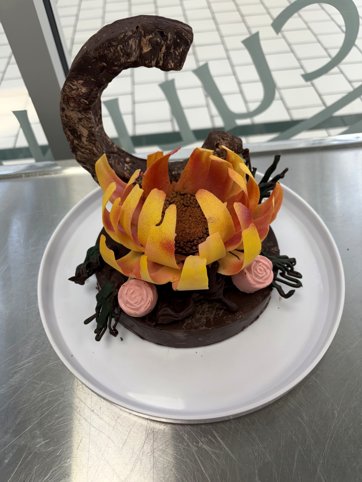 Chocolate sculpture with warm-toned accents