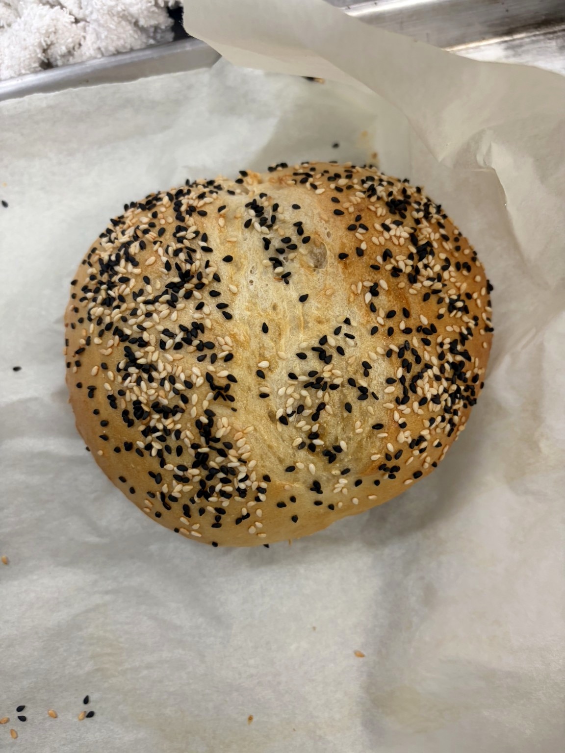 Hand-shaped seeded roll